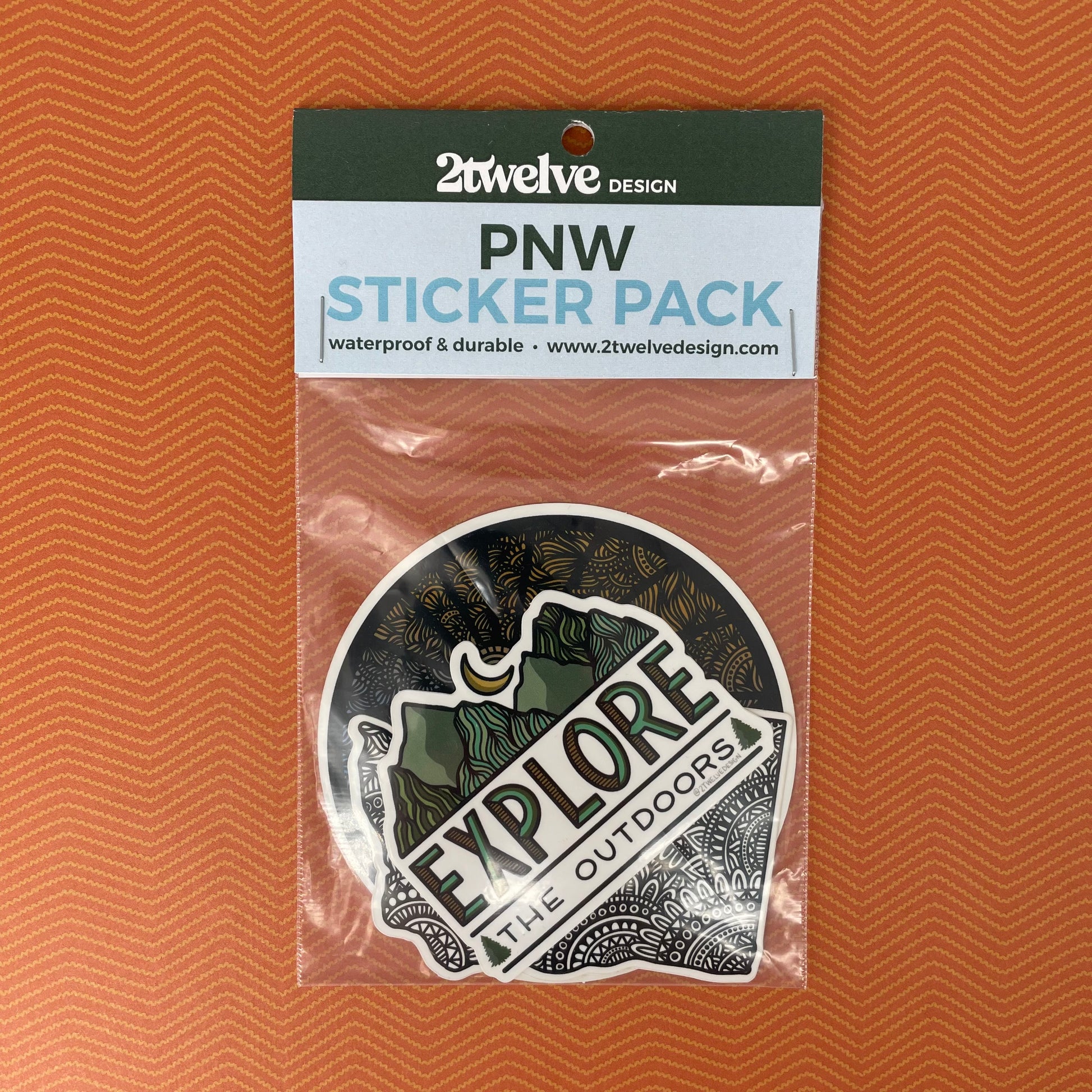 Packaged PNW Sticker Pack with three Northwest themed stickers inside. Laying on a rust orange texture background.