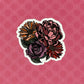 A die-cut vinyl sticker with a hand-drawn floral illustration, predominantly pink with accents of other colors.