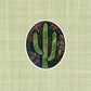 A cute floral, cactus illustration made into an oval vinyl sticker. Laying on a patterned green background.