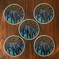 A group of give pacific northwest stickers laying on a wooden surface.
