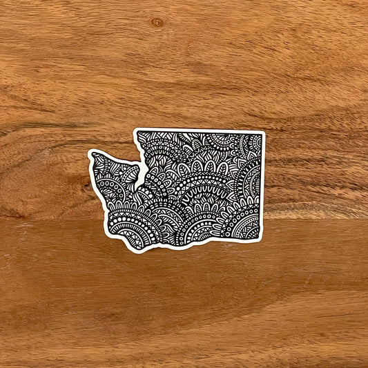 A diecut Washington State sticker with intricate hand drawn details.